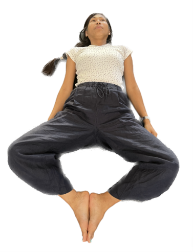 Photograph of woman in the flat frog position
